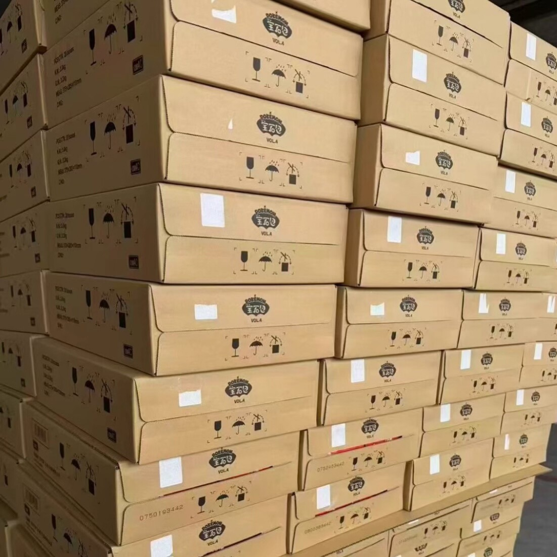 Real Pokémon TCG shipping cartons prepared for stock handling